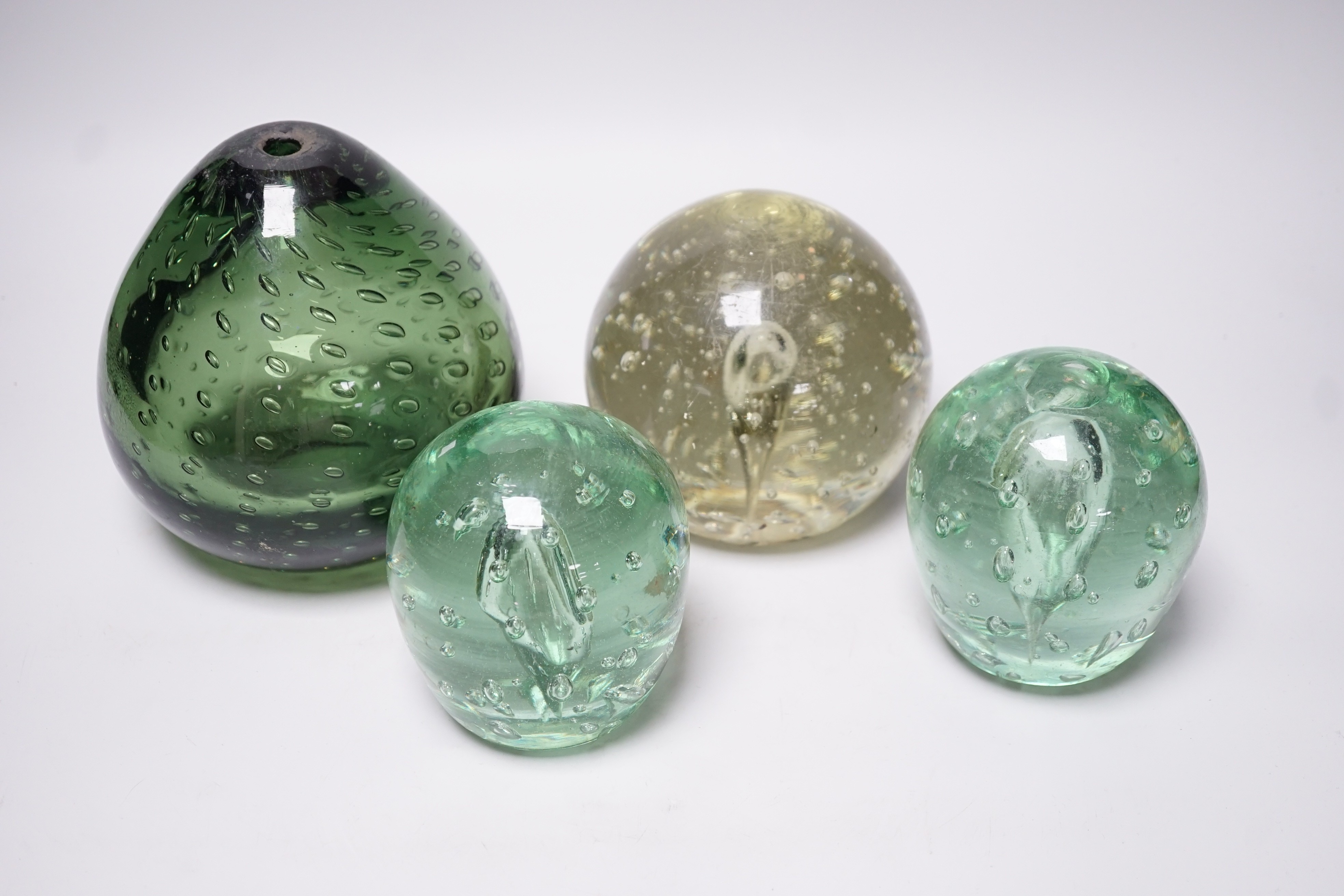Four Victorian green glass dumps, tallest 16cm